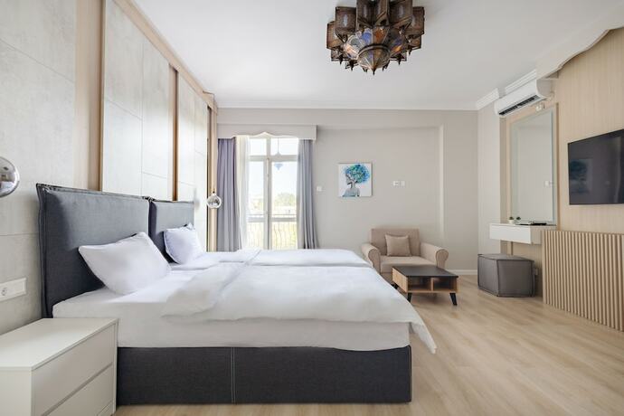 Imagen de la habitación del Hotel Piccolo Mondo by CityBookings. Foto 11