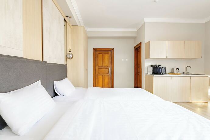 Imagen de la habitación del Hotel Piccolo Mondo by CityBookings. Foto 17