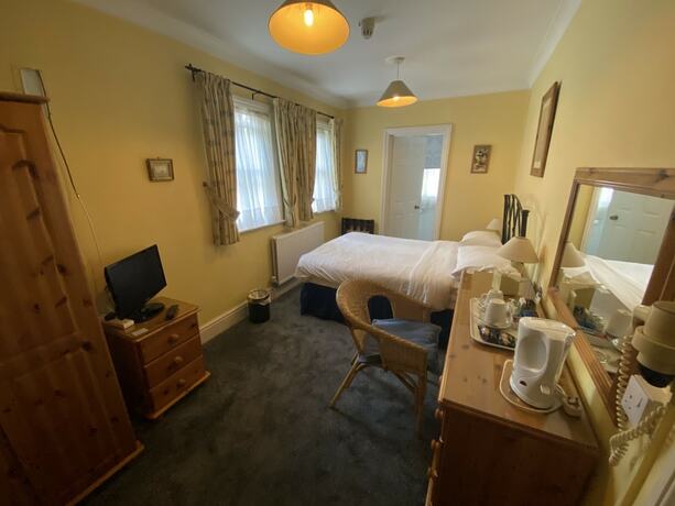 Imagen de la habitación del Hotel Pickwicks Guest House. Foto 12