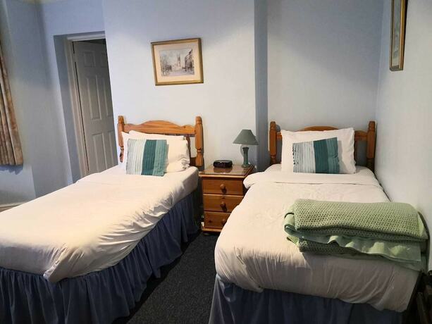 Imagen de la habitación del Hotel Pickwicks Guest House. Foto 15