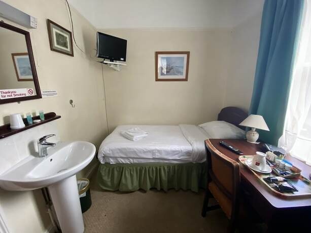 Imagen de la habitación del Hotel Pickwicks Guest House. Foto 16