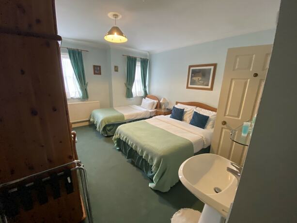 Imagen de la habitación del Hotel Pickwicks Guest House. Foto 18