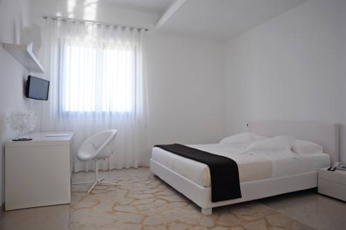 Imagen de la habitación del Hotel Pietre Nere Resort. Foto 8