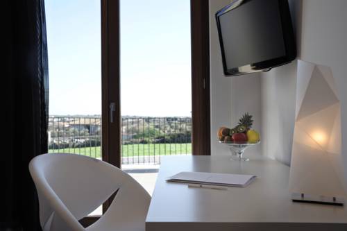 Imagen de la habitación del Hotel Pietre Nere Resort. Foto 10