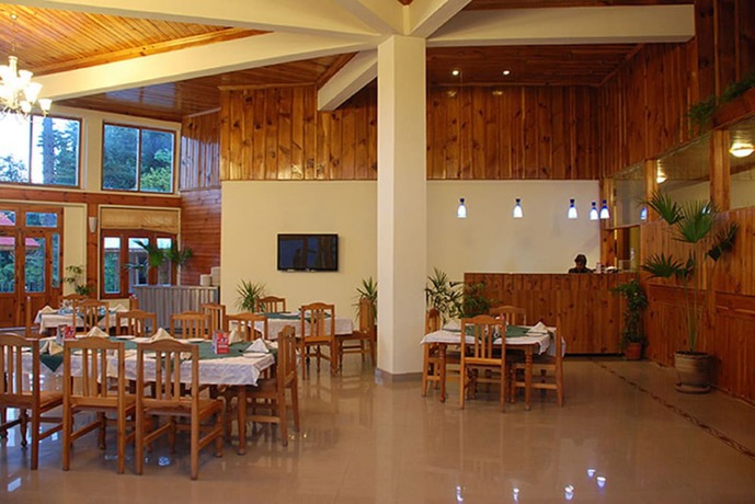 Imagen del bar/restaurante del Hotel Pine Park Glade Resort Shogran. Foto 2