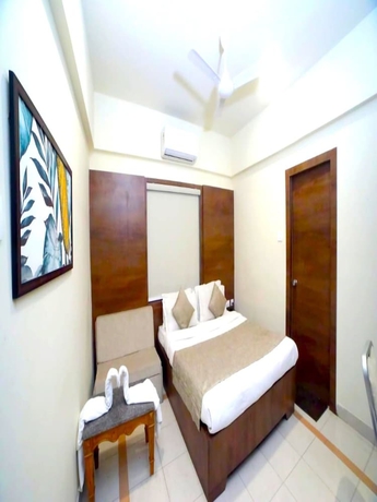 Imagen de la habitación del Hotel Pine Tree, Rajkot. Foto 2