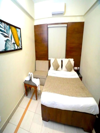 Imagen de la habitación del Hotel Pine Tree, Rajkot. Foto 7