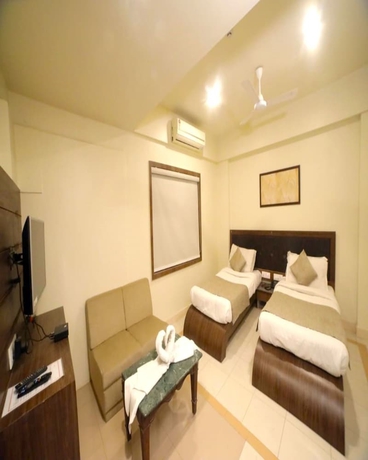 Imagen de la habitación del Hotel Pine Tree, Rajkot. Foto 8