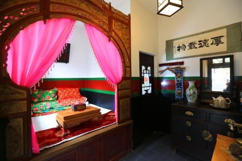 Imagen de la habitación del Hotel Pingyao Yiguan Folk Custom. Foto 6