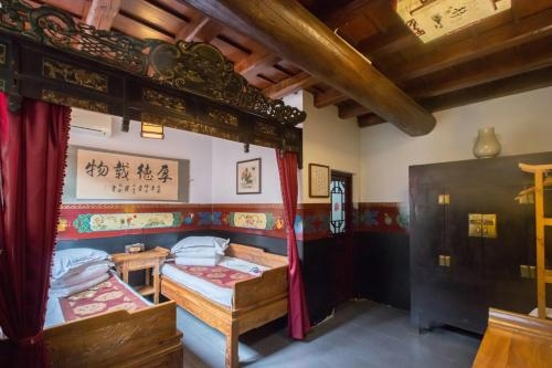 Imagen de la habitación del Hotel Pingyao Yiguan Folk Custom. Foto 7