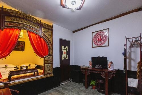 Imagen de la habitación del Hotel Pingyao Yiguan Folk Custom. Foto 8