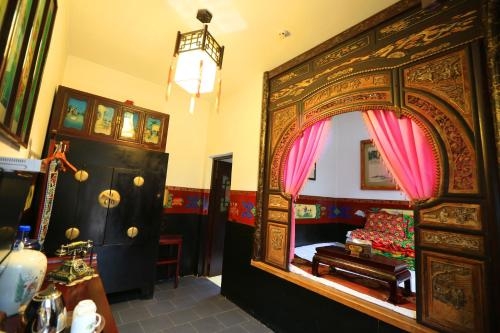 Imagen de la habitación del Hotel Pingyao Yiguan Folk Custom. Foto 9