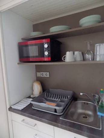 Imagen de la habitación del Hotel Pink House Apartments. Foto 3