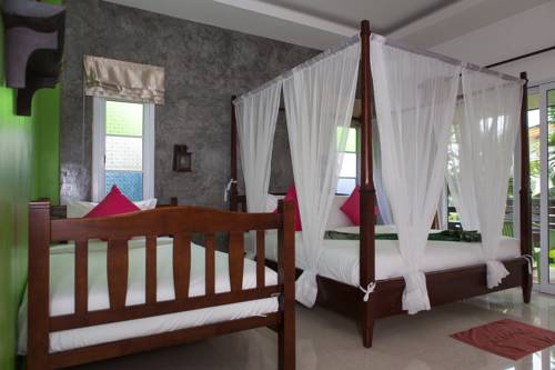 Imagen de la habitación del Hotel Pinky Bungalow Resort. Foto 10