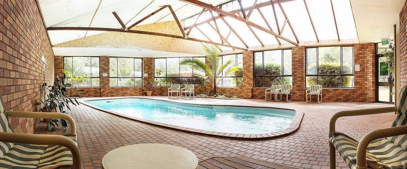 Imagen de la piscina del Hotel Pinnacle Holiday Lodge. Foto 20