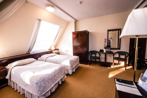 Imagen de la habitación del Hotel Piramida Park & Wellness. Foto 7