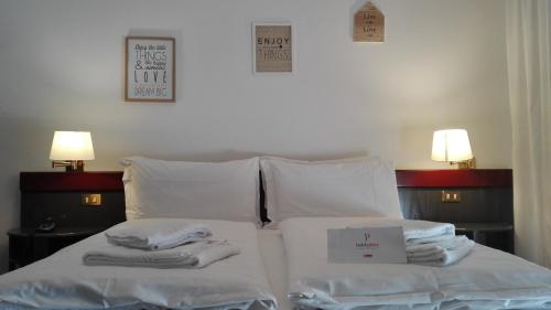 Imagen de la habitación del Hotel Pittini. Foto 7