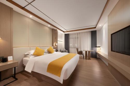 Imagen de la habitación del Hotel Platinum International - Hanjiang Branch memorial archway Street Chaozhou Ancient City. Foto 16