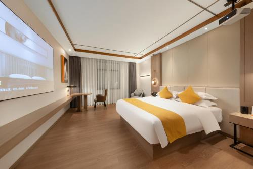 Imagen de la habitación del Hotel Platinum International - Hanjiang Branch memorial archway Street Chaozhou Ancient City. Foto 17