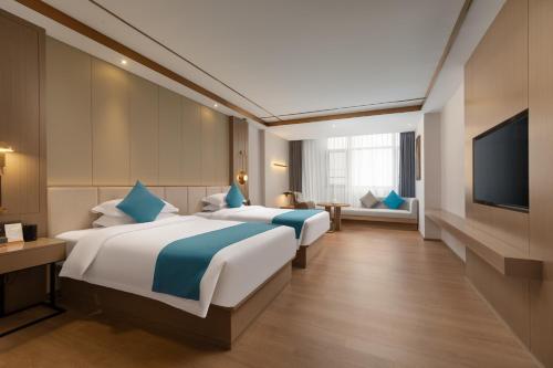 Imagen de la habitación del Hotel Platinum International - Hanjiang Branch memorial archway Street Chaozhou Ancient City. Foto 18