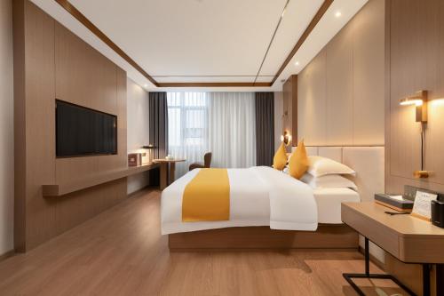 Imagen de la habitación del Hotel Platinum International - Hanjiang Branch memorial archway Street Chaozhou Ancient City. Foto 19