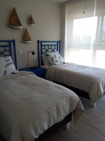 Imagen de la habitación del Hotel Playa Caracol Residences Vacation Rental. Foto 12