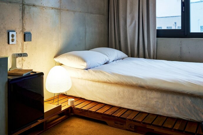 Imagen de la habitación del Hotel Playce Camp Jeju. Foto 25