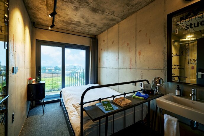 Imagen de la habitación del Hotel Playce Camp Jeju. Foto 29