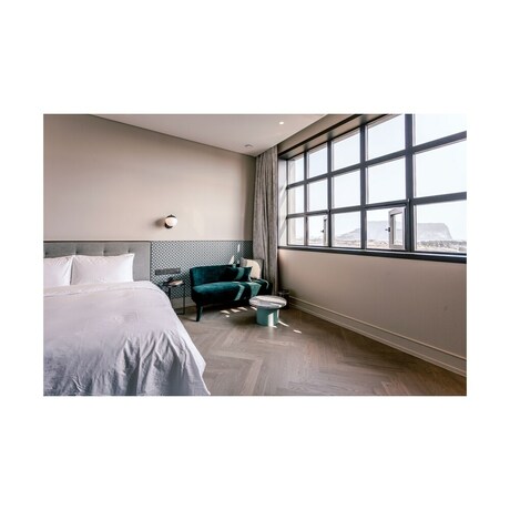 Imagen de la habitación del Hotel Playce Camp Jeju. Foto 30