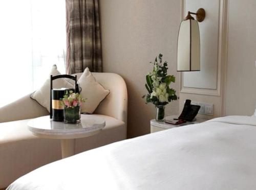 Imagen de la habitación del Hotel Plaza Carnival Qingdao. Foto 6