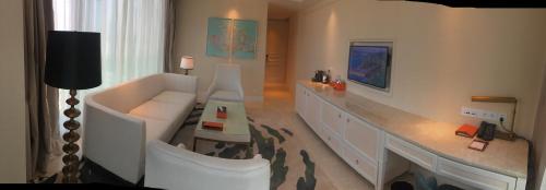Imagen de la habitación del Hotel Plaza Carnival Qingdao. Foto 7
