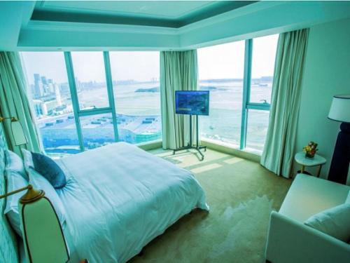 Imagen de la habitación del Hotel Plaza Carnival Qingdao. Foto 8