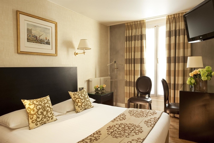 Imagen de la habitación del Hotel Plaza Elysées. Foto 4