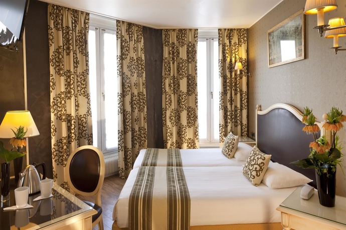 Imagen de la habitación del Hotel Plaza Elysées. Foto 10