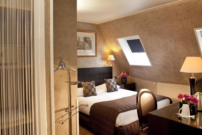 Imagen de la habitación del Hotel Plaza Elysées. Foto 12