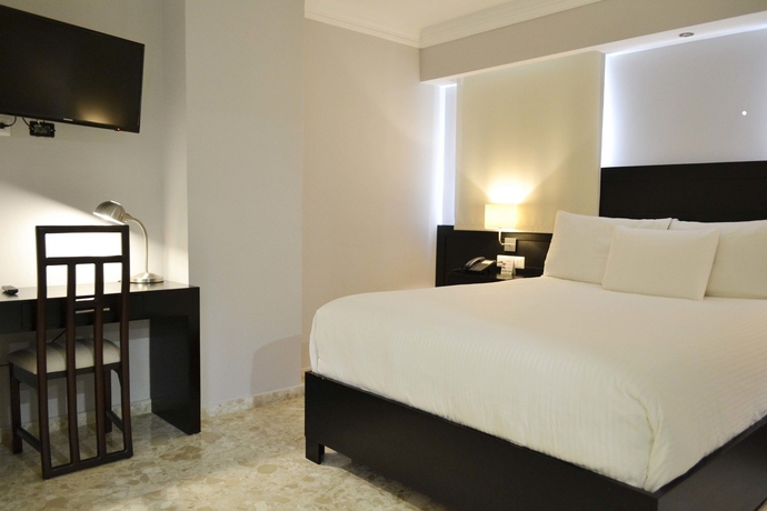 Imagen de la habitación del Hotel Plaza Florida Suites. Foto 15