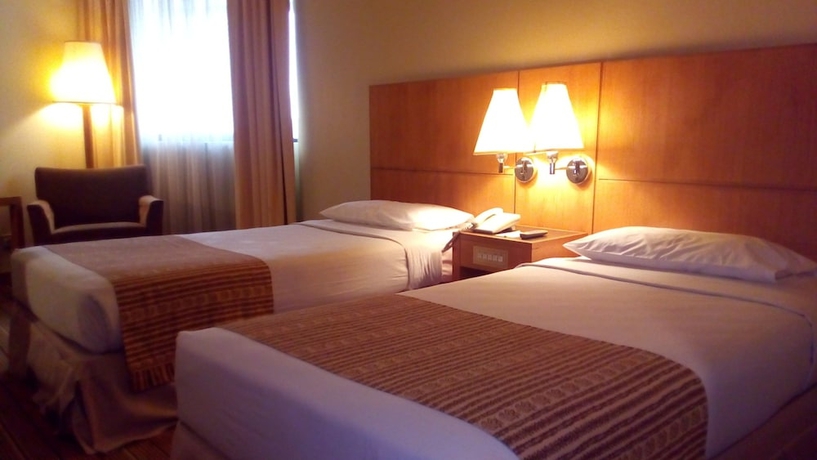 Imagen de la habitación del Hotel Plaza Grand. Foto 11