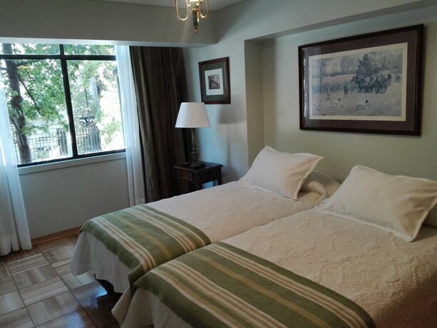 Imagen de la habitación del Hotel Plaza Huelen. Foto 20