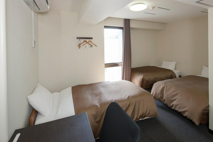 Imagen de la habitación del Hotel Plaza Inn Tokushima. Foto 16
