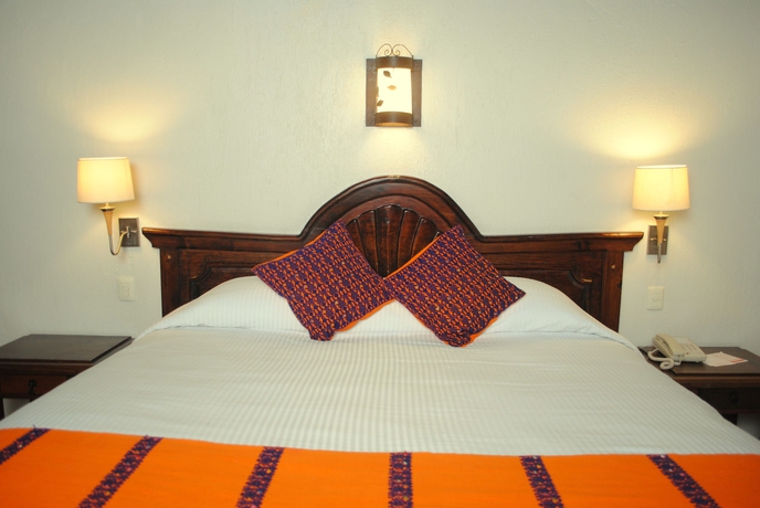 Imagen de la habitación del Hotel Plaza Magnolias. Foto 11