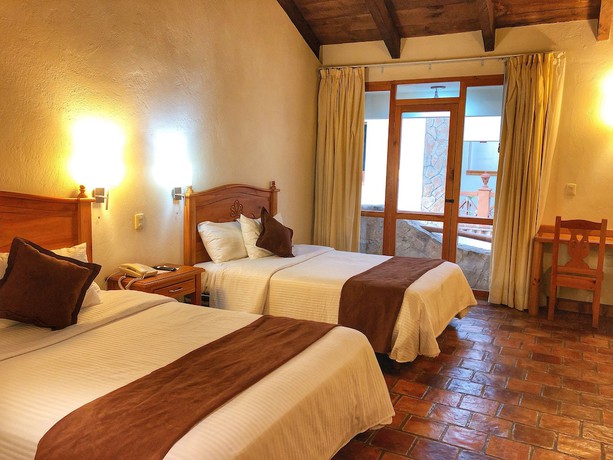 Imagen de la habitación del Hotel Plaza Magnolias Suites. Foto 7