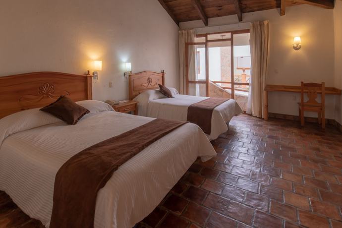 Imagen de la habitación del Hotel Plaza Magnolias Suites. Foto 9