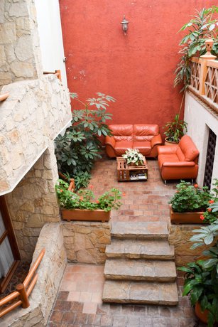 Imagen de la habitación del Hotel Plaza Magnolias Suites. Foto 10