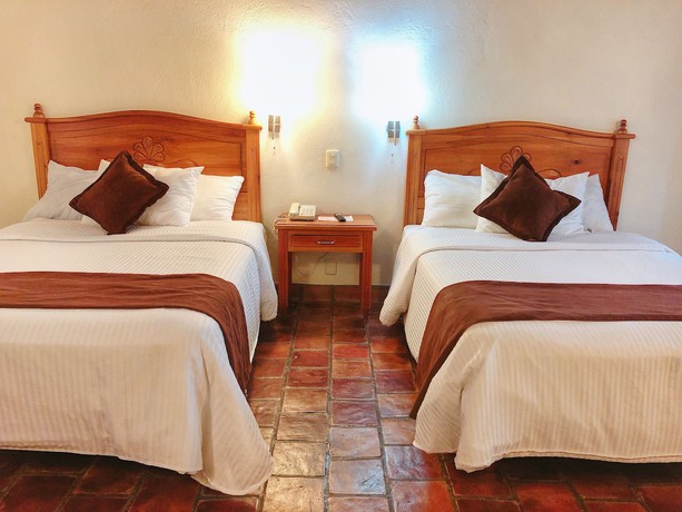 Imagen de la habitación del Hotel Plaza Magnolias Suites. Foto 11