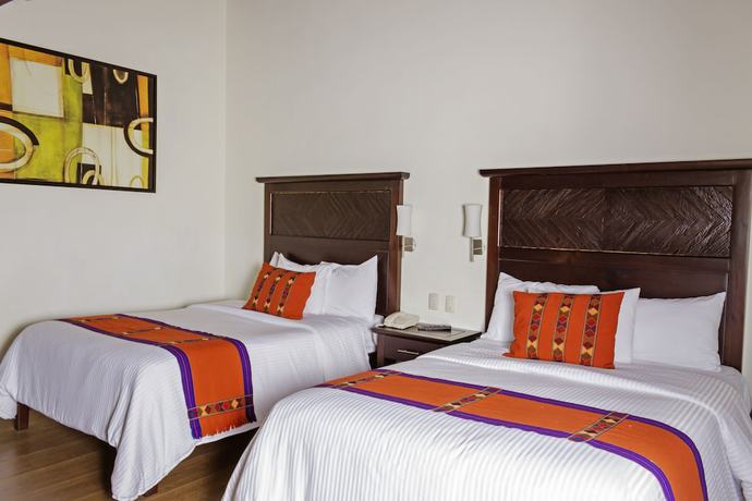 Imagen de la habitación del Hotel Plaza Magnolias Suites. Foto 12