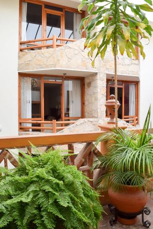 Imagen de la habitación del Hotel Plaza Magnolias Suites. Foto 14