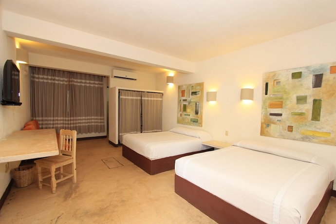 Imagen de la habitación del Hotel Plaza Tangolunda. Foto 7