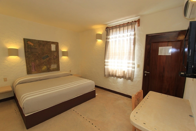 Imagen de la habitación del Hotel Plaza Tangolunda. Foto 14