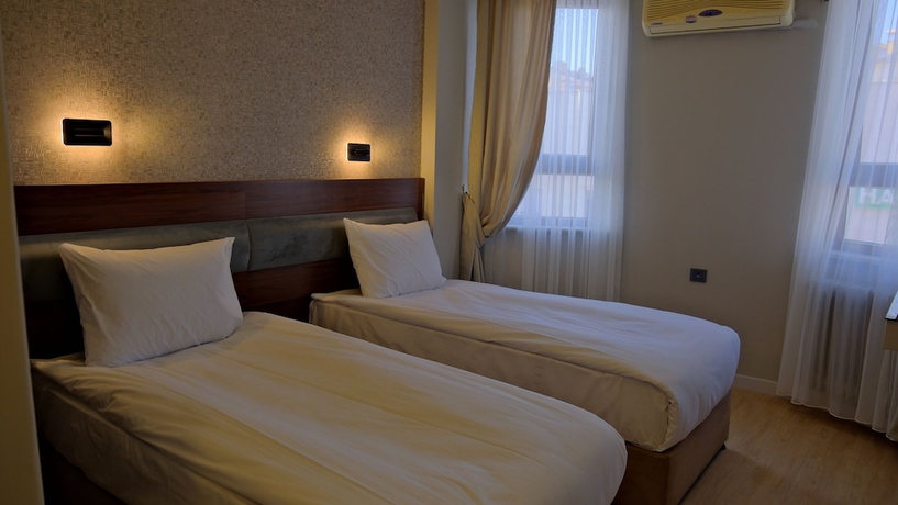 Imagen de la habitación del Hotel Pluscity. Foto 9