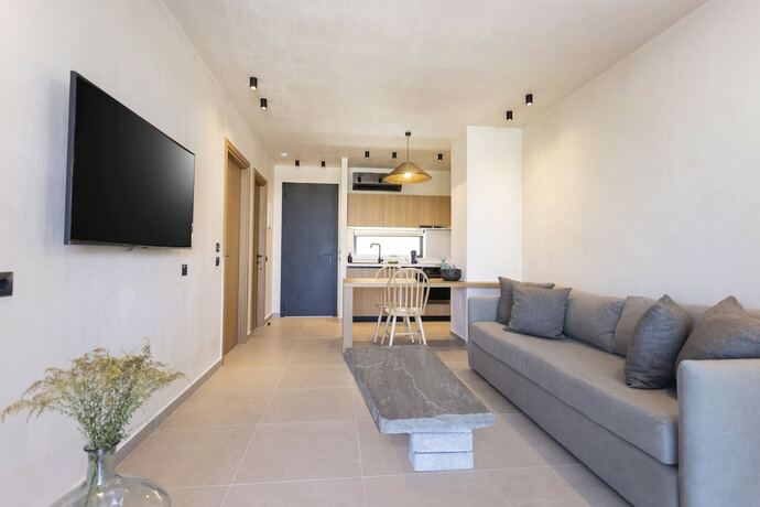 Imagen de la habitación del Hotel Pnoes Luxury Suites. Foto 14